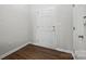 Bright entryway featuring hardwood floors, crisp white trim, and neutral wall paint at 14649 Lions Paw St, Charlotte, NC 28273