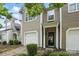 Charming townhouse exterior with a one-car garage, inviting front door, and well-maintained landscaping at 14649 Lions Paw St, Charlotte, NC 28273