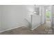 Hallway with carpet, neutral walls, and lighting leading to bedrooms and other rooms at 14649 Lions Paw St, Charlotte, NC 28273