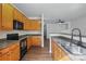 Well-lit kitchen showcasing wooden cabinets, modern appliances, and a functional layout at 14649 Lions Paw St, Charlotte, NC 28273