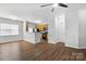 Open-concept living room features hardwood flooring, kitchen access, and lots of natural light at 14649 Lions Paw St, Charlotte, NC 28273