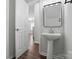 A charming powder room showcasing a pedestal sink and modern design at 14649 Lions Paw St, Charlotte, NC 28273