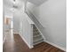 Carpeted staircase featuring white railing and neutral walls, connecting levels of the home at 14649 Lions Paw St, Charlotte, NC 28273