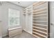 Spacious walk-in closet featuring built-in shelves, drawers, and ample storage space at 14649 Lions Paw St, Charlotte, NC 28273