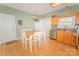 Bright eat-in kitchen area features stainless steel appliances, natural light, and a cozy dining table at 1556 Berkshire Dr, Newton, NC 28658