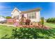 Inviting single-story home featuring a red deck, stone accents, and a well-manicured front lawn at 1556 Berkshire Dr, Newton, NC 28658