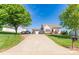 Picturesque home featuring a long driveway, attached garage, and lush green trees, providing a serene setting at 1556 Berkshire Dr, Newton, NC 28658