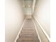 Carpeted stairs with white railing lead to upper level at 1556 Berkshire Dr, Newton, NC 28658
