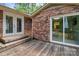 Wooden deck with seating area, accessible through sliding glass doors, offering a perfect space for outdoor relaxation at 182 Freedom Mill Rd, Gastonia, NC 28052