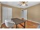 Bedroom featuring hardwood flooring, a closet, ceiling fan, desk, and neutral walls at 182 Freedom Mill Rd, Gastonia, NC 28052