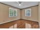 Bedroom featuring hardwood flooring, two large windows and neutral walls at 182 Freedom Mill Rd, Gastonia, NC 28052