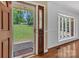 Inviting foyer features hardwood floors, a decorative front door, and a large bay window showcasing the landscaped front yard at 182 Freedom Mill Rd, Gastonia, NC 28052