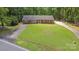 Charming one-story brick home with a sprawling front lawn and long driveway, offering ample parking at 182 Freedom Mill Rd, Gastonia, NC 28052