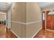 Hallway with wood floors and half wall molding at 182 Freedom Mill Rd, Gastonia, NC 28052