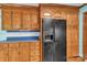 Well-maintained kitchen offers wooden cabinets, black appliances, and tile countertops at 182 Freedom Mill Rd, Gastonia, NC 28052