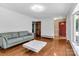 Cozy living room features hardwood floors, large windows, and access to the front door at 182 Freedom Mill Rd, Gastonia, NC 28052