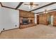 Spacious living room boasts a brick fireplace and ceiling beams at 182 Freedom Mill Rd, Gastonia, NC 28052