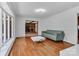 Sun-filled living room features hardwood floors, large windows and stylish, neutral decor at 182 Freedom Mill Rd, Gastonia, NC 28052