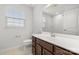 Bathroom with double sink vanity, tile floor, large mirror, white toilet, and shower with glass doors at 1933 Tin Roof Ln, Monroe, NC 28112