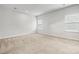 A bright bedroom with neutral carpet and three large windows at 1933 Tin Roof Ln, Monroe, NC 28112