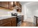 Modern kitchen featuring granite countertops, stainless appliances, and wood cabinets at 1933 Tin Roof Ln, Monroe, NC 28112