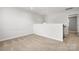 Loft area with neutral carpet, light walls, access to the staircase, and recessed lighting at 1933 Tin Roof Ln, Monroe, NC 28112