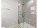 Walk-in shower featuring glass door and tile surround at 1933 Tin Roof Ln, Monroe, NC 28112