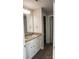 Bathroom vanity featuring double sinks with granite counters, white cabinets, and wood flooring at 200 N Kayla Dr, Salisbury, NC 28146