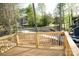 View from a spacious wooden deck with wood railing overlooking a green yard and neighborhood at 200 N Kayla Dr, Salisbury, NC 28146