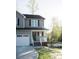 Charming two-story home with gray siding, a covered front porch, and an attached garage at 200 N Kayla Dr, Salisbury, NC 28146