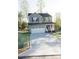 Exterior view of a two-story home with gray siding, a front porch, and a two-car garage at 200 N Kayla Dr, Salisbury, NC 28146
