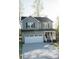 A charming two-story house with gray siding, an attached garage, and a well-manicured front yard at 200 N Kayla Dr, Salisbury, NC 28146