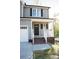 Charming home exterior featuring gray siding, black shutters, a covered porch, and a well-manicured lawn at 200 N Kayla Dr, Salisbury, NC 28146