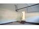 Spacious garage interior with white walls, concrete floors, and steps leading to an interior door at 200 N Kayla Dr, Salisbury, NC 28146