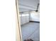 Spacious garage with white walls, a concrete floor, and a brick trim along the base at 200 N Kayla Dr, Salisbury, NC 28146