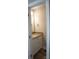 A small half-bathroom featuring a vanity with a light granite countertop and wood-look floors at 200 N Kayla Dr, Salisbury, NC 28146