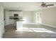 Bright kitchen featuring white cabinets, granite countertops, stainless steel appliances and open floor plan at 200 N Kayla Dr, Salisbury, NC 28146