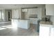 Bright and airy kitchen featuring white cabinets, granite countertops, and stainless steel appliances at 200 N Kayla Dr, Salisbury, NC 28146