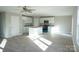 Bright kitchen featuring white cabinets, granite countertops, stainless steel appliances and open floor plan at 200 N Kayla Dr, Salisbury, NC 28146