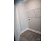This functional laundry room features wood flooring and a wire shelf for storage at 200 N Kayla Dr, Salisbury, NC 28146