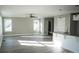 Open-concept living space featuring hardwood floors, a ceiling fan, and access to the kitchen area at 200 N Kayla Dr, Salisbury, NC 28146
