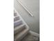 A carpeted staircase with a white handrail in a home with neutral paint at 200 N Kayla Dr, Salisbury, NC 28146