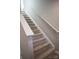 Carpeted staircase featuring white handrails and trim leading to the upper level at 200 N Kayla Dr, Salisbury, NC 28146