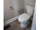 Close-up of a standard white toilet with a chrome toilet paper holder in a neutral-toned bathroom at 200 N Kayla Dr, Salisbury, NC 28146