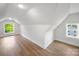 Finished attic space with laminate wood flooring, white walls, recessed lighting, and a window at 217 S Green St, Wadesboro, NC 28170