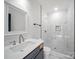 Modern bathroom with a marble shower, updated fixtures, and a bright white color palette at 217 S Green St, Wadesboro, NC 28170