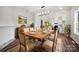 Dining room with an elegant table set for dinner, chandelier, and a view into the kitchen at 217 S Green St, Wadesboro, NC 28170