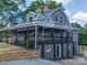 Charming two-story home with a inviting covered front porch, brick accents, and landscaped yard at 217 S Green St, Wadesboro, NC 28170