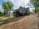 A two-story home, showing a backyard deck, and a walkout basement at 217 S Green St, Wadesboro, NC 28170