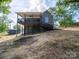 A two-story home, showing a backyard deck, and a walkout basement at 217 S Green St, Wadesboro, NC 28170